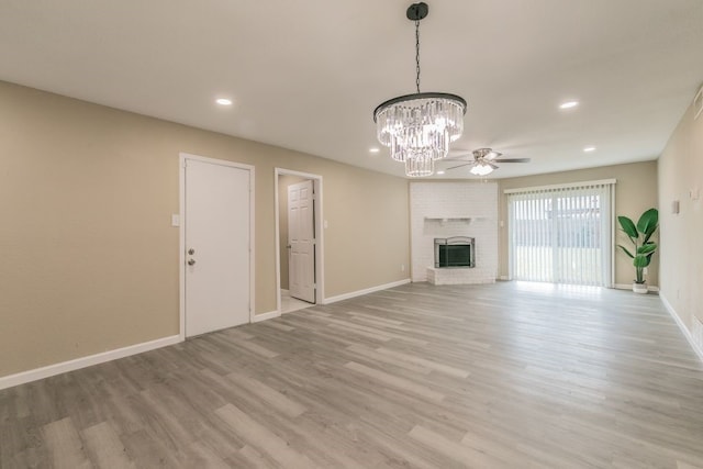 2400 Clearwood Dr, Arlington, TX 76014 - unfurnished living room with recessed lighting, light wood finished floors, a ceiling fan, baseboards, and a fireplace