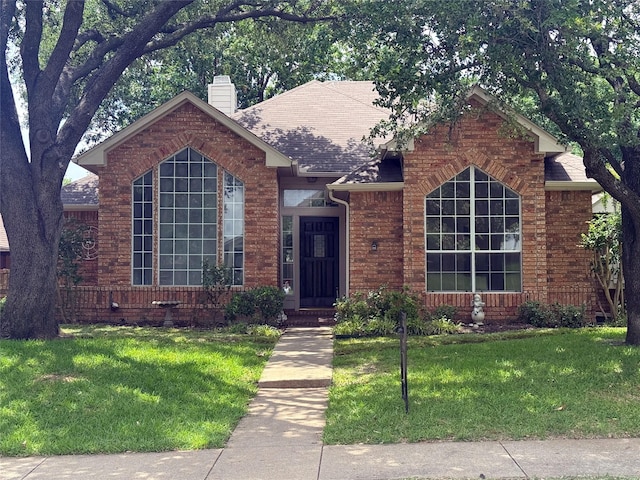 4209 Harvest Hill Ct, Carrollton, TX 75010 - ranch-style house with a chimney, a front yard, brick siding, and a shingled roof