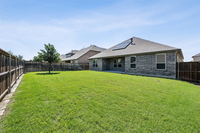 6217 Cheshire St, Celina, TX 76227 - rear view of property with brick siding, roof mounted solar panels, and a shingled roof
