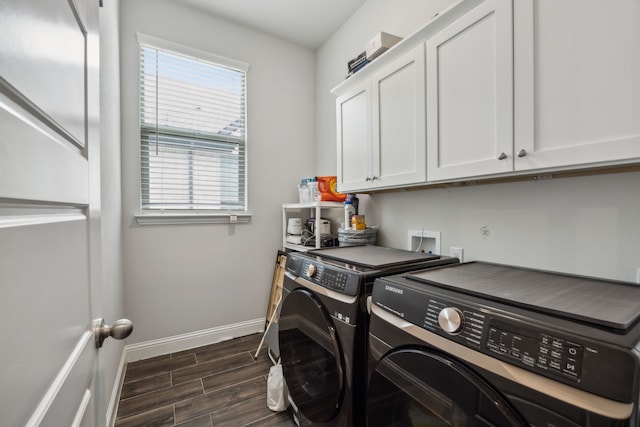 2811 Trinity Ridge St, Mansfield, TX 76063 - laundry area featuring washing machine and dryer, cabinet space, baseboards, and dark wood-style floors