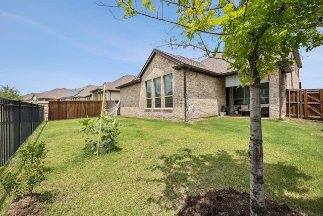2811 Trinity Ridge St, Mansfield, TX 76063 - back of house featuring brick siding and roof with shingles