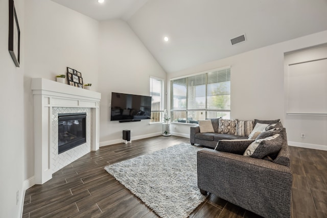 2811 Trinity Ridge St, Mansfield, TX 76063 - living room with dark wood-style floors, baseboards, a fireplace, recessed lighting, and high vaulted ceiling