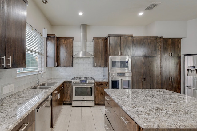 2728 Gull Lake Dr, Plano, TX 75025 - kitchen with appliances with stainless steel finishes, a sink, wall chimney exhaust hood, light stone countertops, and recessed lighting