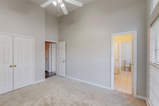 2728 Gull Lake Dr, Plano, TX 75025 - unfurnished bedroom with a towering ceiling, carpet, a closet, baseboards, and connected bathroom