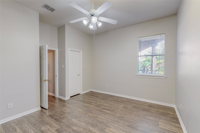 2728 Gull Lake Dr, Plano, TX 75025 - spare room with wood finished floors, baseboards, and a ceiling fan