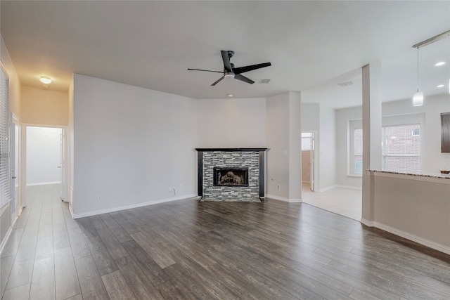 2728 Gull Lake Dr, Plano, TX 75025 - unfurnished living room featuring ceiling fan, wood finished floors, a fireplace, and baseboards