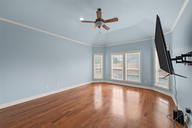 1405 Gunnison Dr, Waco, TX 76712 - spare room featuring ceiling fan, baseboards, wood finished floors, crown molding, and vaulted ceiling