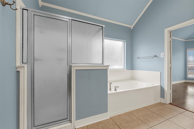 1405 Gunnison Dr, Waco, TX 76712 - bathroom featuring ornamental molding, a shower stall, a bath, lofted ceiling, and tile patterned flooring