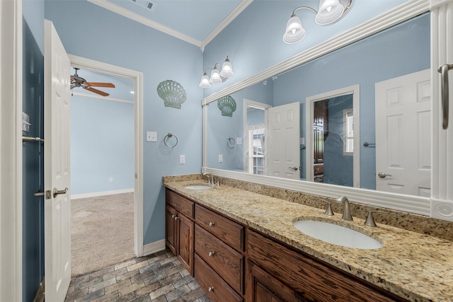1405 Gunnison Dr, Waco, TX 76712 - full bathroom with crown molding, brick flooring, double vanity, baseboards, and a ceiling fan