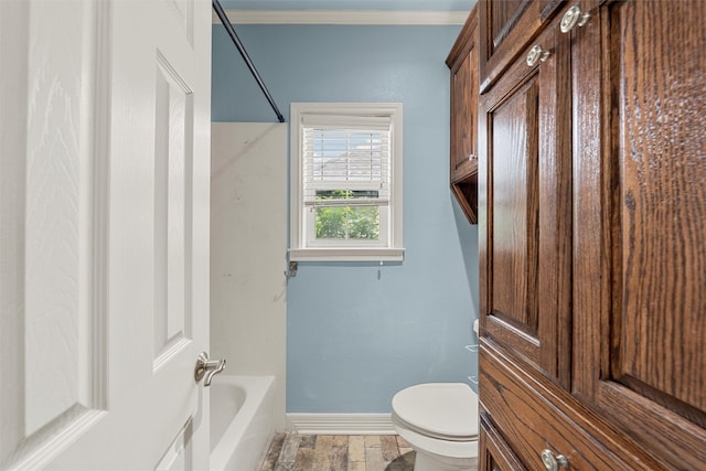 1405 Gunnison Dr, Waco, TX 76712 - bathroom featuring toilet, baseboards, crown molding, and shower / bath combination