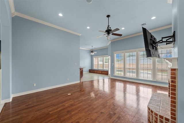 1405 Gunnison Dr, Waco, TX 76712 - unfurnished living room featuring a ceiling fan, ornamental molding, wood finished floors, a fireplace, and recessed lighting