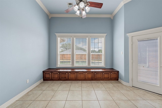1405 Gunnison Dr, Waco, TX 76712 - spare room with ornamental molding, a ceiling fan, light tile patterned floors, and baseboards