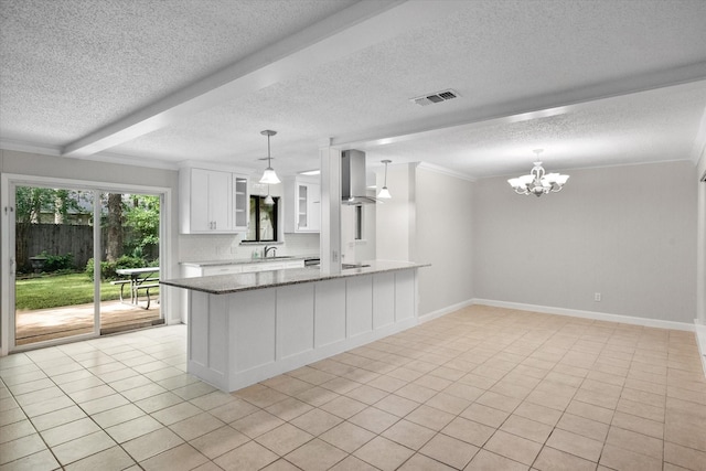 3416 Bristol Dr, Arlington, TX 76013 - kitchen with wall chimney exhaust hood, a sink, stone countertops, white cabinetry, and a textured ceiling