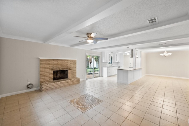 3416 Bristol Dr, Arlington, TX 76013 - unfurnished living room with light tile patterned floors, beamed ceiling, a brick fireplace, a textured ceiling, and a ceiling fan
