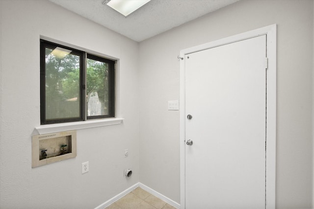 3416 Bristol Dr, Arlington, TX 76013 - washroom with hookup for a washing machine, electric dryer hookup, baseboards, and light tile patterned floors