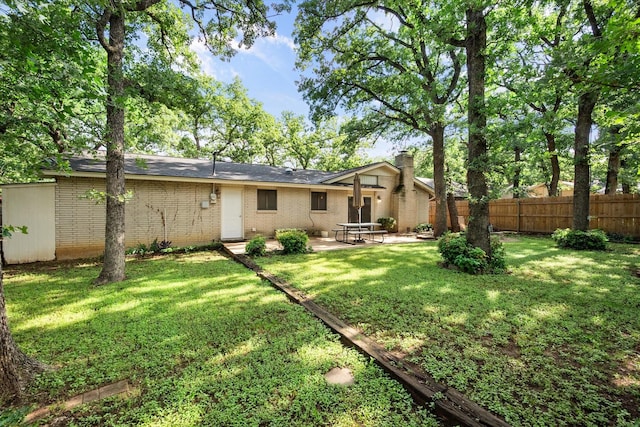 3416 Bristol Dr, Arlington, TX 76013 - rear view of property featuring a patio, brick siding, and a chimney