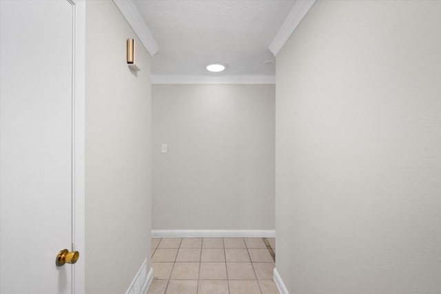3416 Bristol Dr, Arlington, TX 76013 - empty room featuring light tile patterned floors, crown molding, baseboards, and a textured ceiling