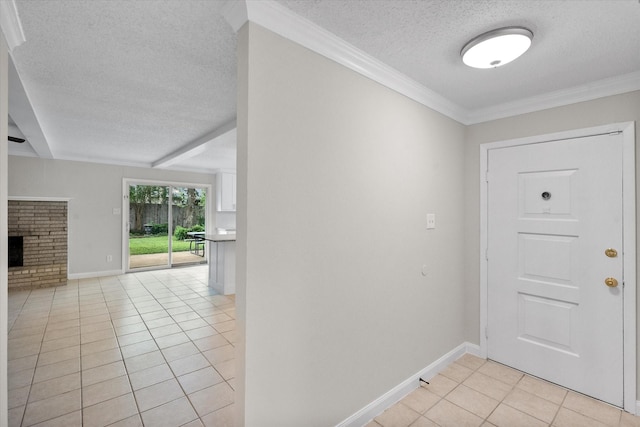 3416 Bristol Dr, Arlington, TX 76013 - foyer with a textured ceiling, light tile patterned floors, baseboards, a fireplace, and ornamental molding