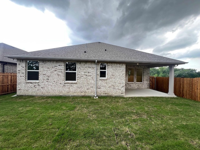2121 Williams, Princeton, TX 75407 - back of house featuring a shingled roof, a patio, and brick siding