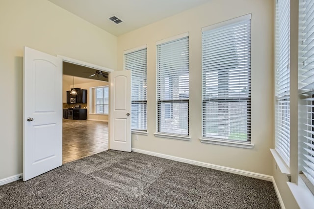 597 W Fate Main Pl, Fate, TX 75087 - tiled spare room featuring carpet floors and a ceiling fan