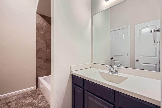 597 W Fate Main Pl, Fate, TX 75087 - bathroom with vanity and baseboards