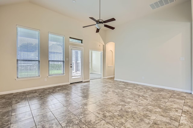 597 W Fate Main Pl, Fate, TX 75087 - tiled empty room featuring vaulted ceiling, a ceiling fan, and arched walkways