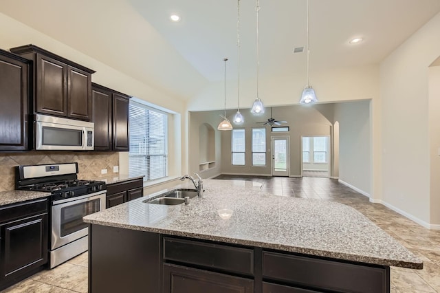 597 W Fate Main Pl, Fate, TX 75087 - unfurnished living room with a towering ceiling, a ceiling fan, arched walkways, and recessed lighting