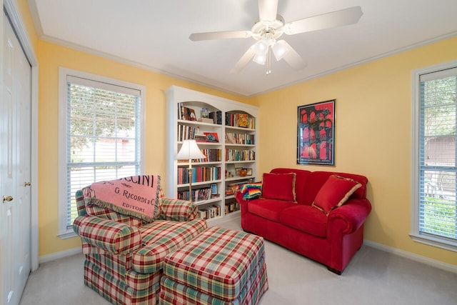 1317 Radisson Dr, Hewitt, TX 76643 - living area featuring carpet floors, baseboards, crown molding, and ceiling fan