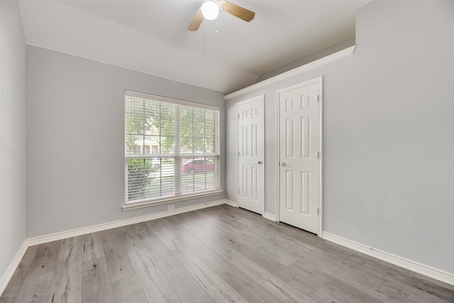 1707 Balboa Ln, Allen, TX 75002 - unfurnished bedroom featuring vaulted ceiling, wood finished floors, baseboards, ceiling fan, and multiple closets