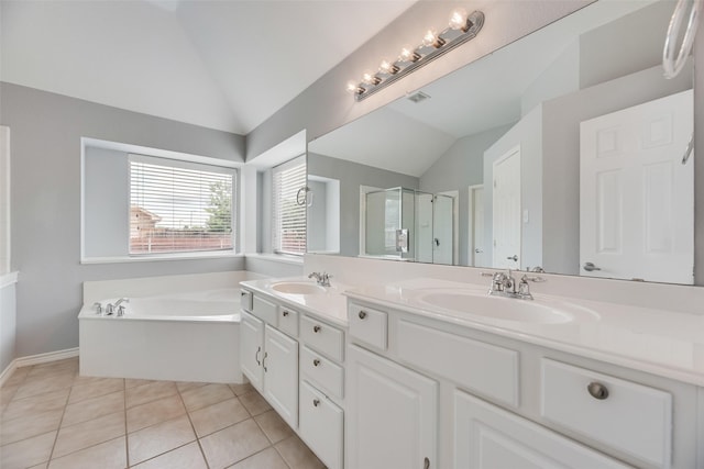 1707 Balboa Ln, Allen, TX 75002 - bathroom featuring vaulted ceiling, double vanity, a stall shower, a bath, and tile patterned floors