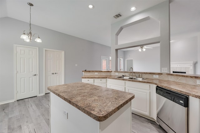 1707 Balboa Ln, Allen, TX 75002 - kitchen with dishwasher, a sink, lofted ceiling, ceiling fan, and a center island