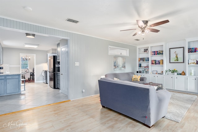 361 Carrollton Ave, Shreveport, LA 71105 - living area with ceiling fan, light wood-style flooring, built in features, and crown molding