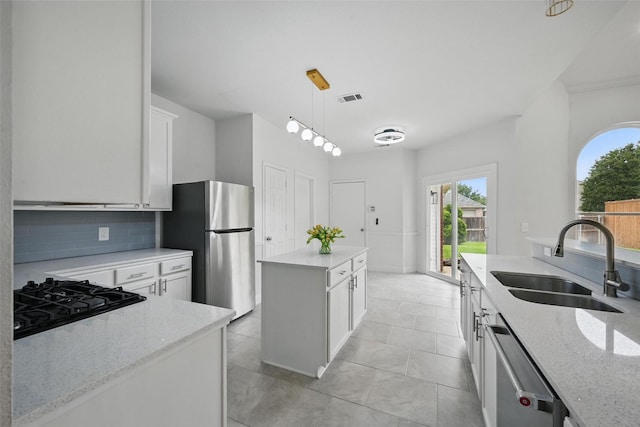 4309 Cutter Springs Ct, Plano, TX 75024 - kitchen with a sink, stainless steel appliances, healthy amount of natural light, and light stone counters