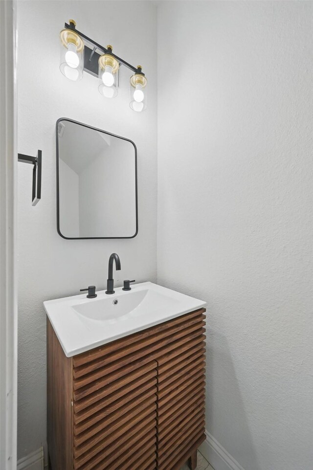 4309 Cutter Springs Ct, Plano, TX 75024 - bathroom featuring vanity and baseboards