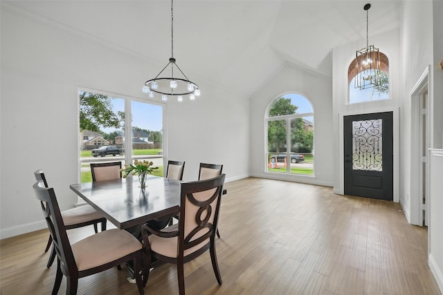 4309 Cutter Springs Ct, Plano, TX 75024 - dining room featuring a chandelier, healthy amount of natural light, baseboards, and high vaulted ceiling