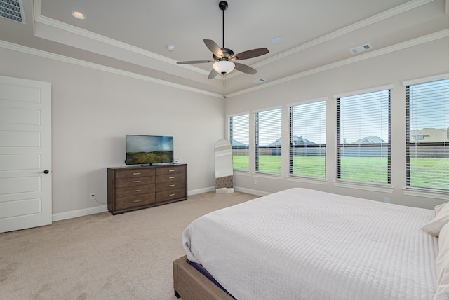 8220 Stonewall Dr, Waxahachie, TX 75167 - bedroom featuring a tray ceiling, light colored carpet, baseboards, crown molding, and ceiling fan