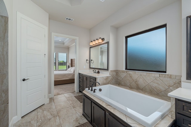 8220 Stonewall Dr, Waxahachie, TX 75167 - ensuite bathroom featuring a bath, vanity, and marble finish flooring