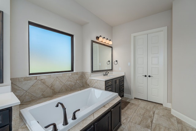 8220 Stonewall Dr, Waxahachie, TX 75167 - full bathroom featuring vanity, a bath, and baseboards