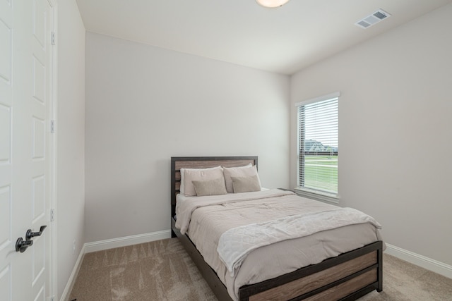 8220 Stonewall Dr, Waxahachie, TX 75167 - bedroom featuring light carpet and baseboards