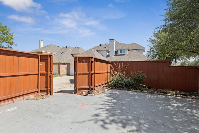 1084 Leisure Ln, Irving, TX 75063 - fenced backyard featuring a patio