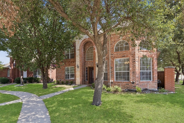1084 Leisure Ln, Irving, TX 75063 - view of front facade with a front yard and brick siding