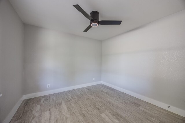 703 E Center St E, Duncanville, TX 75116 - spare room with ceiling fan, wood finished floors, and baseboards