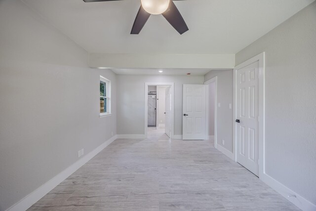 703 E Center St E, Duncanville, TX 75116 - empty room featuring ceiling fan, baseboards, and light wood-style floors