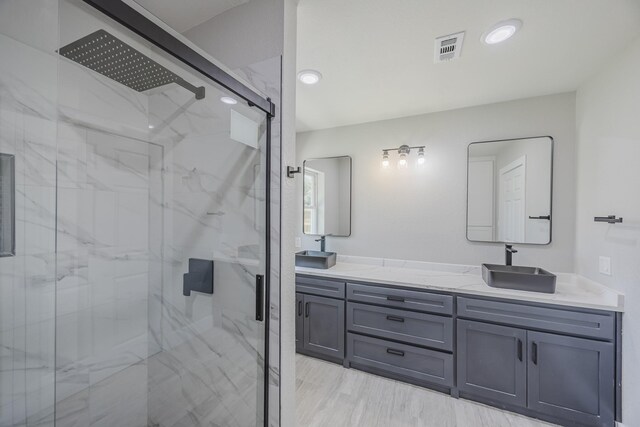 703 E Center St E, Duncanville, TX 75116 - full bath with a marble finish shower and double vanity