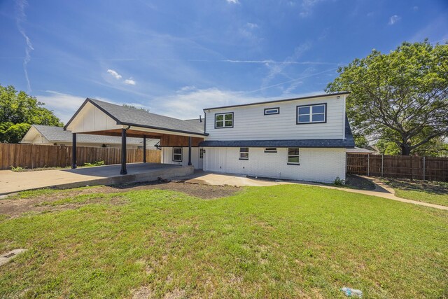 703 E Center St E, Duncanville, TX 75116 - rear view of house featuring a patio area and brick siding