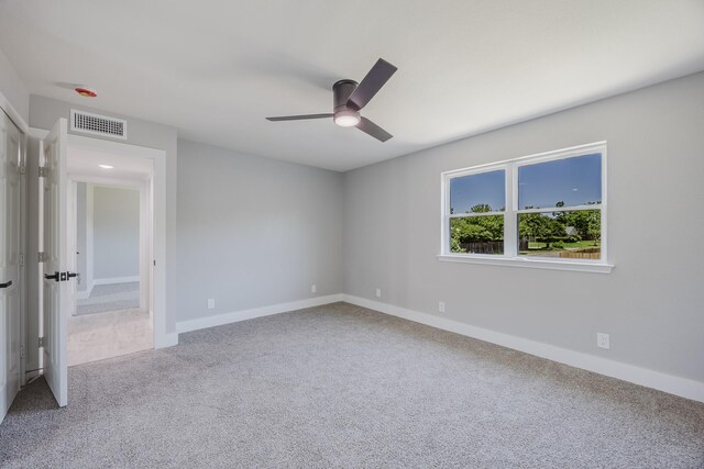 703 E Center St E, Duncanville, TX 75116 - unfurnished bedroom featuring carpet flooring, baseboards, and ceiling fan