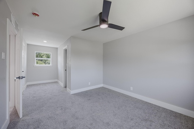 703 E Center St E, Duncanville, TX 75116 - spare room featuring carpet, a ceiling fan, and baseboards