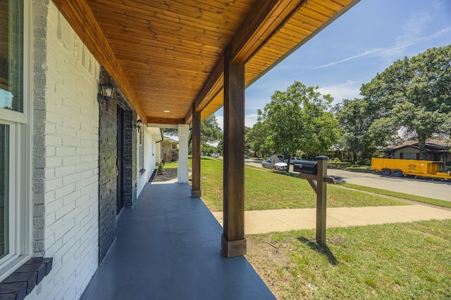 703 E Center St E, Duncanville, TX 75116 - porch featuring a lawn