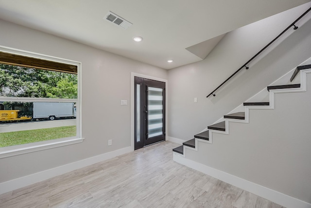 703 E Center St E, Duncanville, TX 75116 - entrance foyer featuring stairway, baseboards, wood finished floors, and recessed lighting