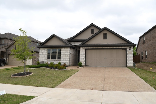1311 Rosler St, Mansfield, TX 76063 - view of front facade with concrete driveway, brick siding, a front yard, an attached garage, and stucco siding